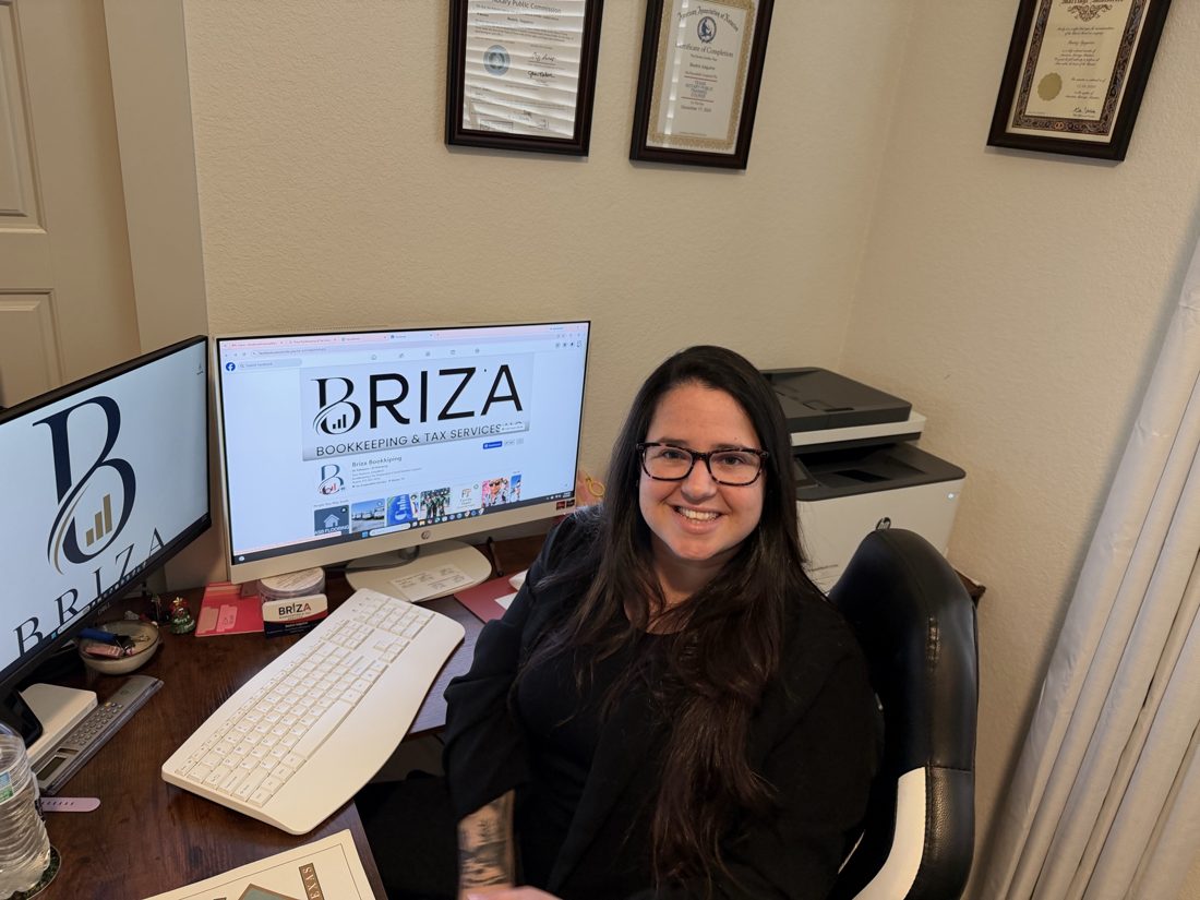 Beatriz Izaguirre, founder of Briza Bookkeeping & Tax Services, at her office desk
